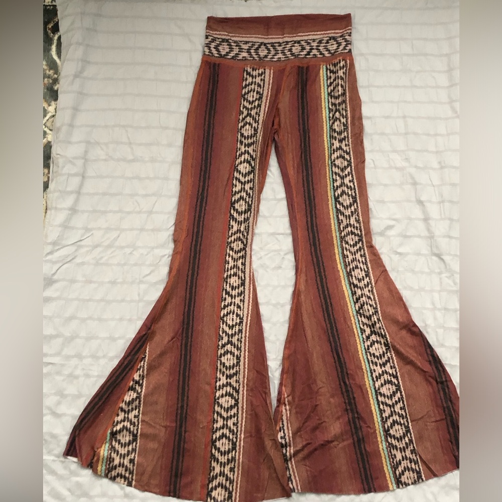 Teeki women’s bell bottoms. Size L. Made in the USA of recycled plastic bottles.